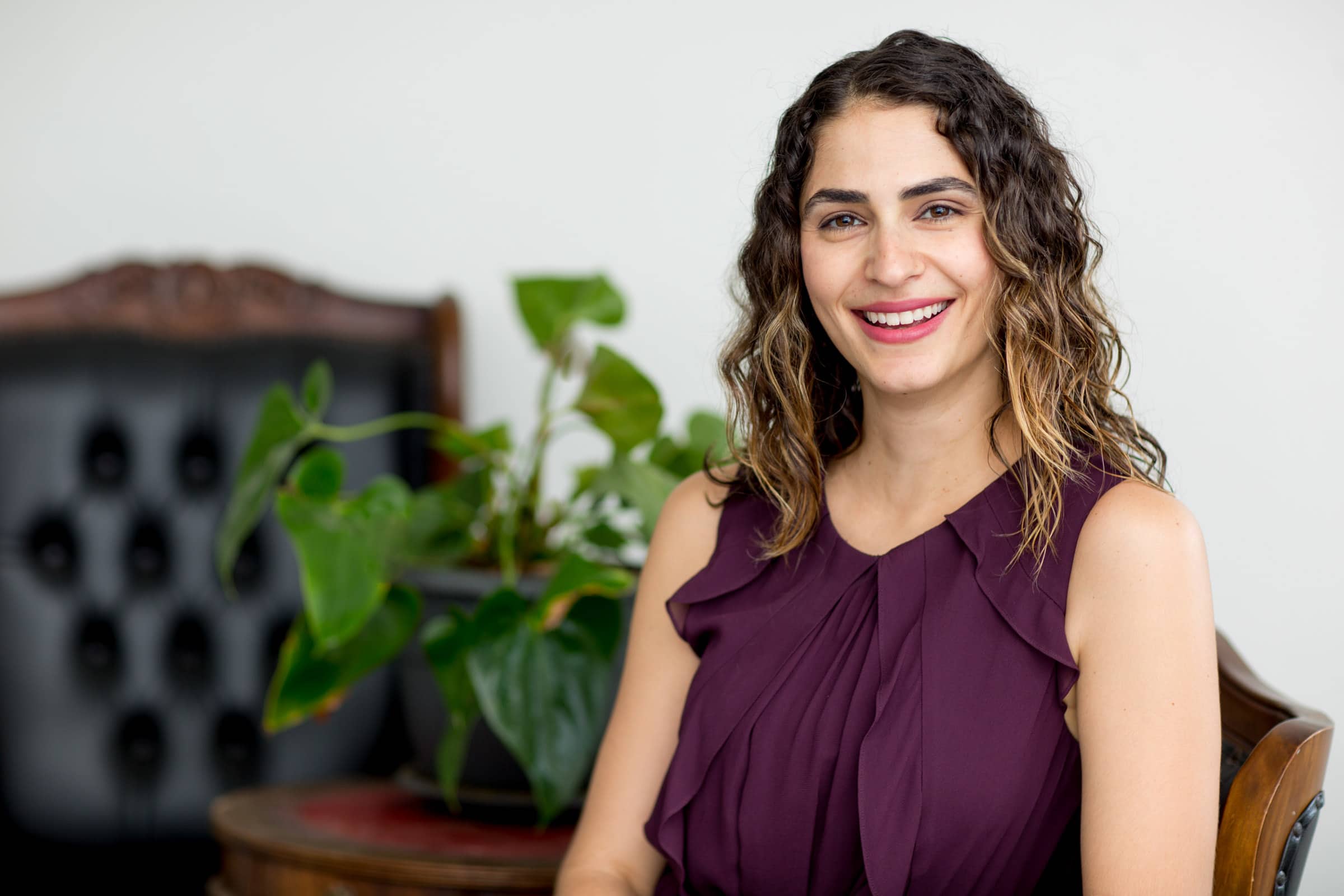 professional headshot lady on soft furnishings