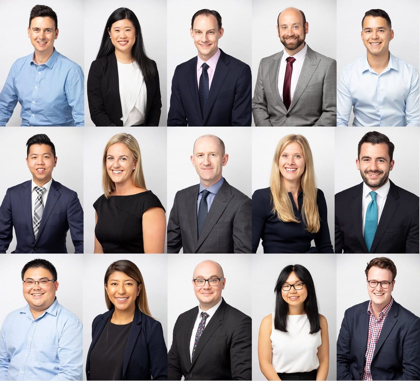 Corporate headshots featuring a diverse group of 15 professionals arranged in three rows. The individuals are dressed in formal business attire, including suits, blazers, and dresses, against a clean white background. The mix of men and women, representing a range of ethnicities and roles, highlights professionalism, teamwork, and diversity in the workplace. Ideal for corporate team introductions, LinkedIn profiles, or company branding materials.