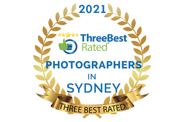 The image showcases Hero Shot Photography's recognition as one of the "Three Best Rated Photographers in Sydney" for 2021. This accolade highlights Hero Shot's expertise in professional headshot photography, catering to both individuals and businesses. The award was based on comprehensive criteria, including customer feedback, service quality, reputation, and overall excellence in professional photography. It reflects Hero Shot Photography's dedication to delivering premium services and building strong client relationships. This distinction cements the company’s leadership in corporate headshots, personal branding, and team branding photography. With offices in Sydney (Annandale), Melbourne, and Brisbane, Hero Shot Photography offers tailored services such as professional headshots for teams and individuals, polished LinkedIn profile imagery, and comprehensive corporate branding campaigns. Each location specializes in meeting local demands, ensuring consistency in quality and customer satisfaction. The Sydney office focuses on corporate headshots and branding sessions, the Melbourne office excels in executive portraits and workplace imagery, and the Brisbane office emphasizes corporate branding photography for businesses of all sizes.