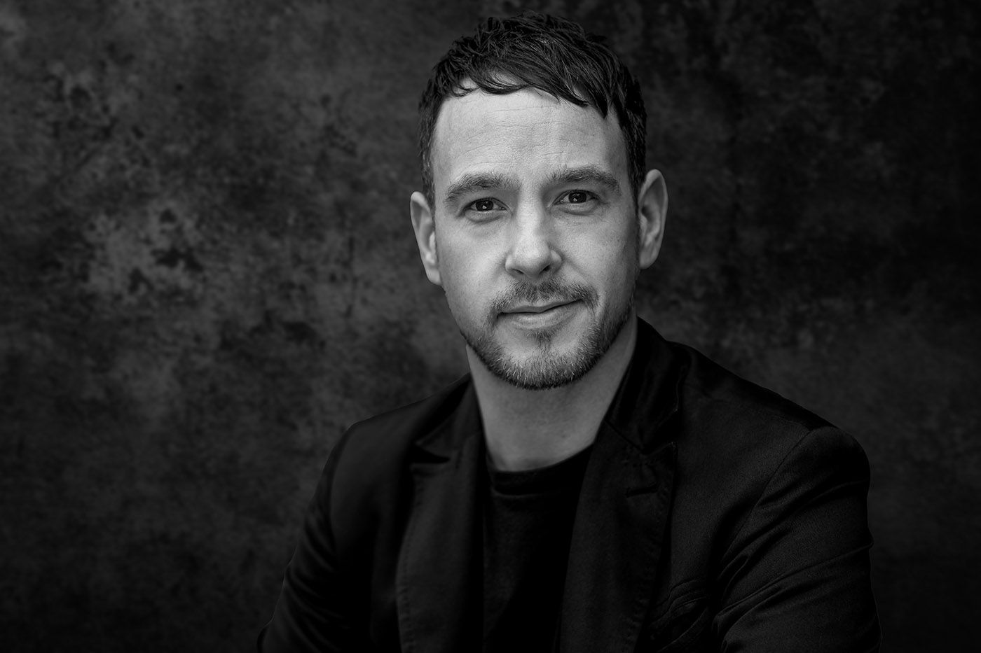 close up male headshot in black and white