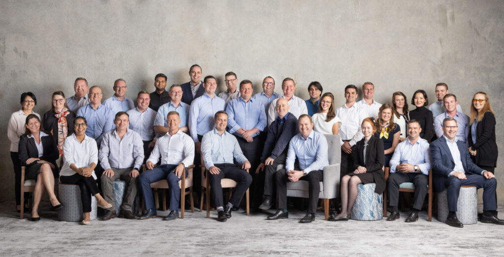 large team portrait of professional people sitting and smiling