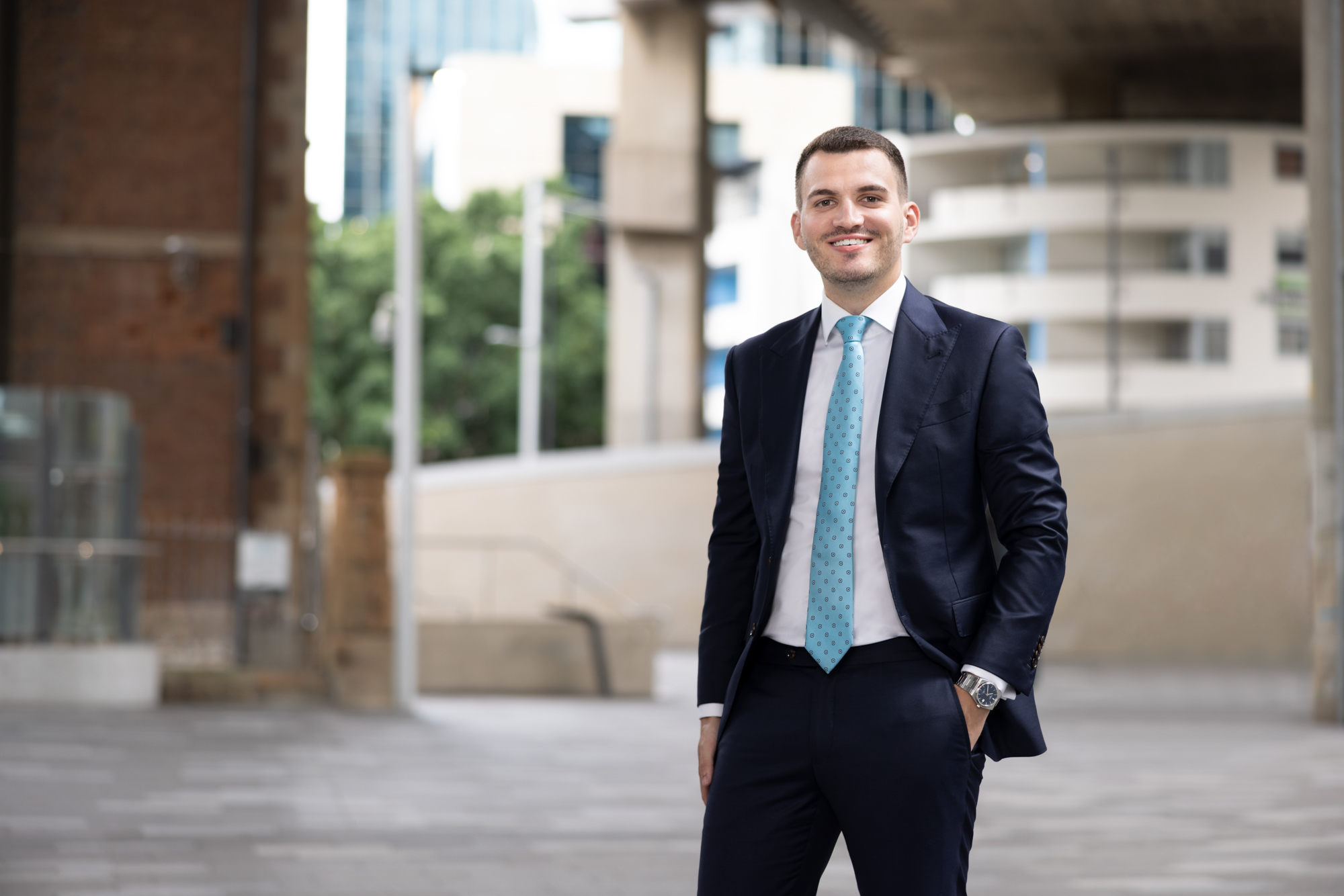 Man standing in a suit in the city