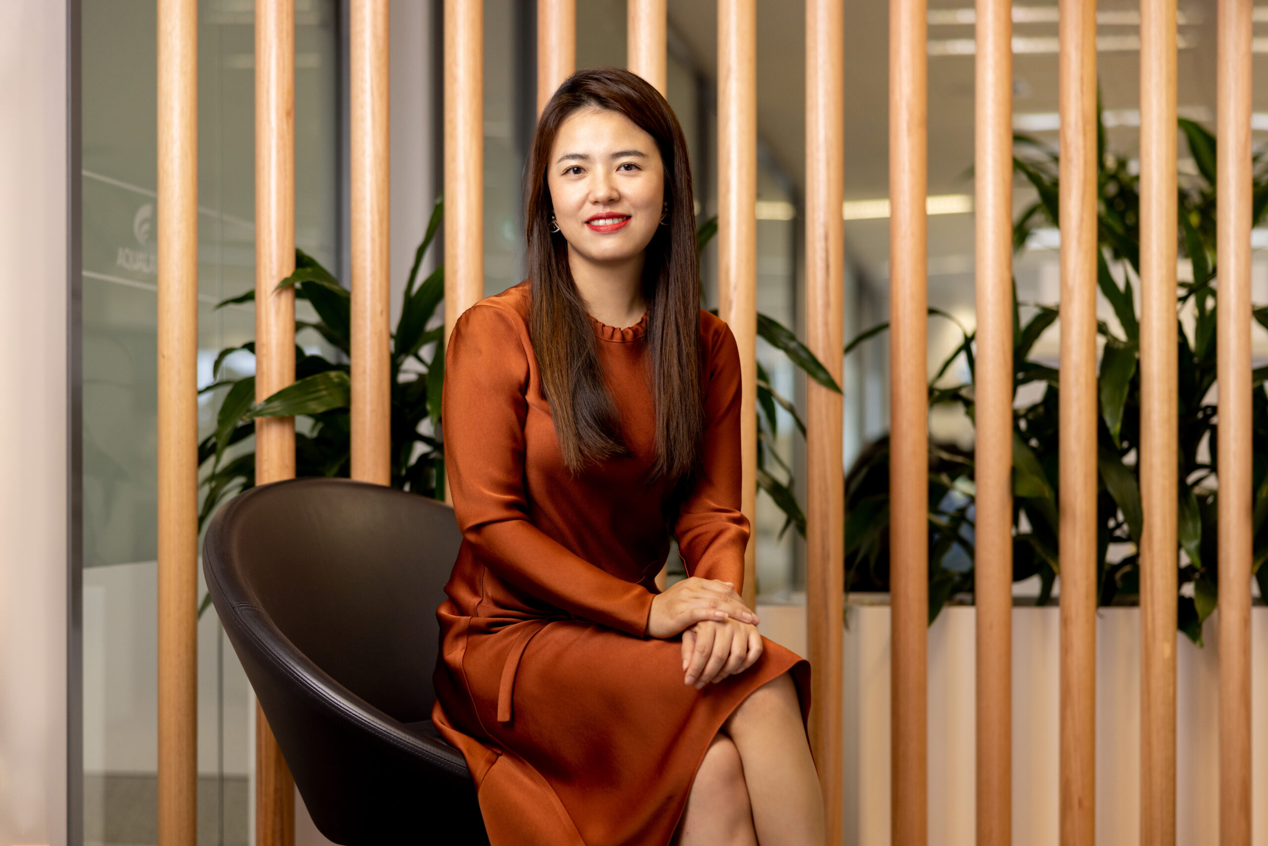 female sitting in a chair in office