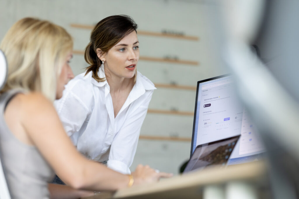 People working over a computer in office environment